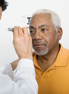 Man getting an eye check-up for Eye disease at Bard Optical Peoria Shoppes at Grand Prairie