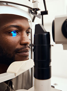 Man getting eye health exam in Bard Optical Decatur