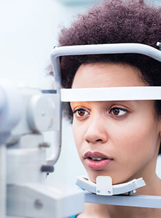 Woman getting comprehensive eye health exam