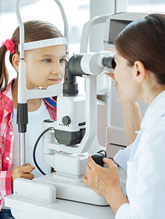 Little girl having an eye exam at Bard Optical in Champaign, IL