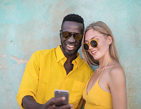Couple wearing anti-reflective sunglasses